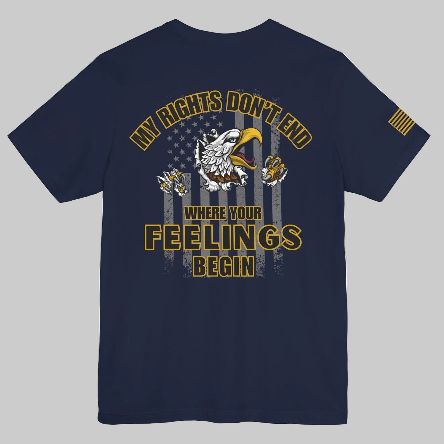 Navy blue short-sleeve T-shirt with large gold and white eagle and American flag graphic on the back and the words ‘My Rights Don’t End Where Your Feelings Begin,’ plus a small gold American flag patch on the right sleeve, shown on a white background.