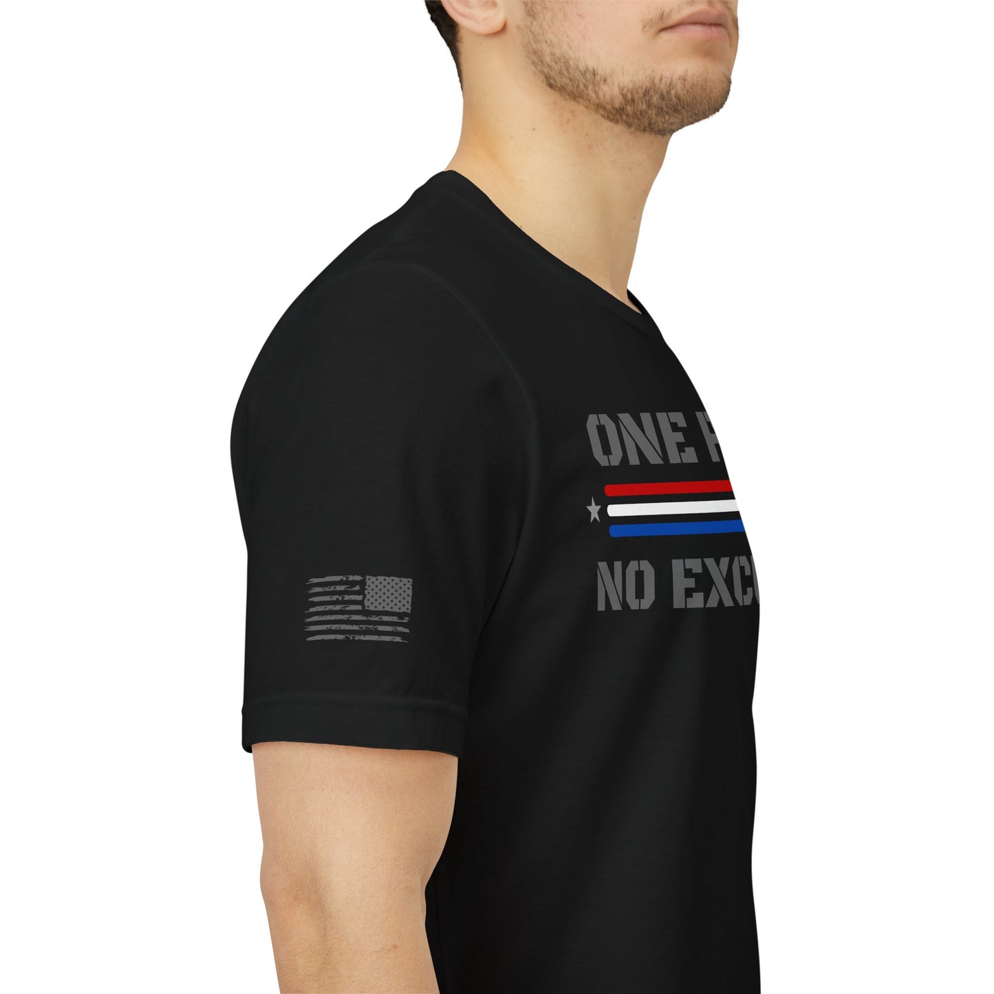 Side view of a man wearing a black “One Flag No Excuses” t-shirt.