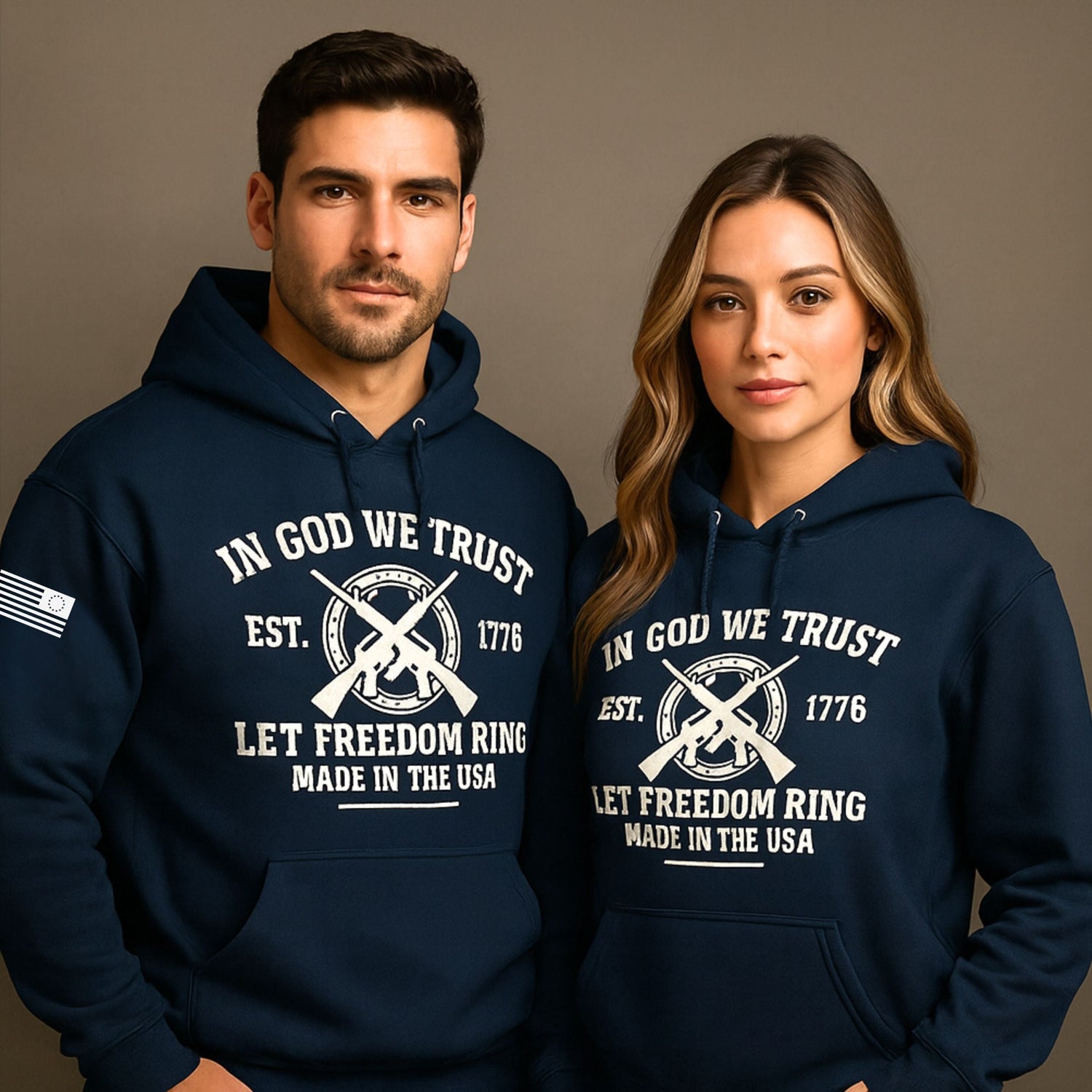 Man and woman wearing navy 1776 patriotic hoodies