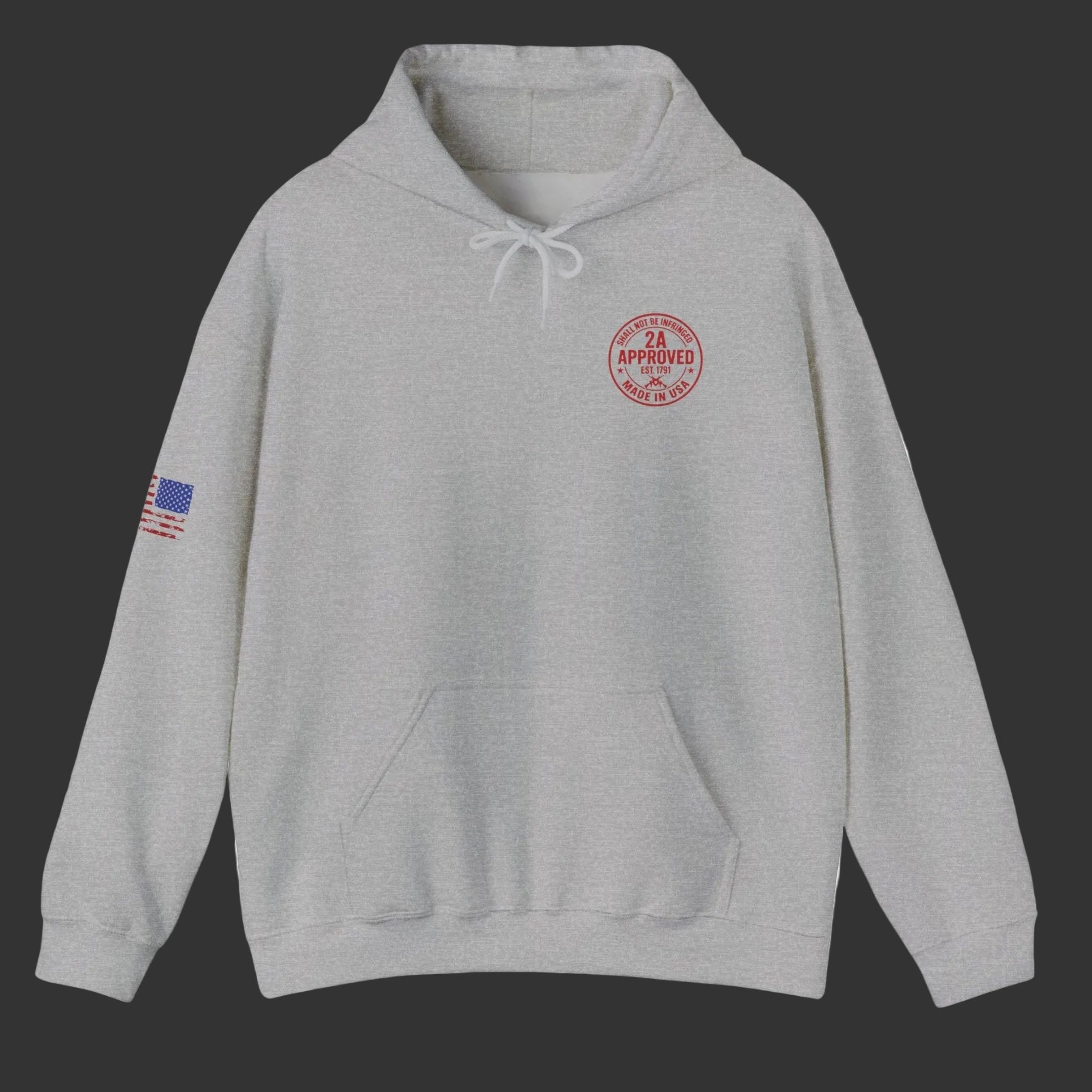 Sport Grey unisex hoodie, front view; red circular left-chest emblem and U.S. flag patch on sleeve, dark grey  background.