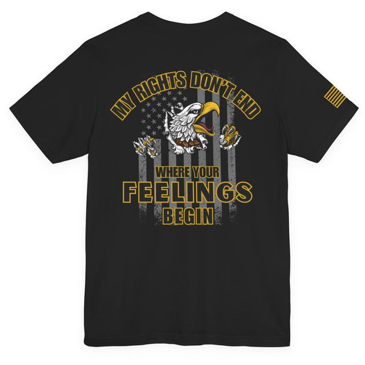 Black short-sleeve T-shirt with large gold and white eagle and American flag graphic on the back and the words ‘My Rights Don’t End Where Your Feelings Begin,’ plus a small gold American flag patch on the right sleeve, shown on a white background.