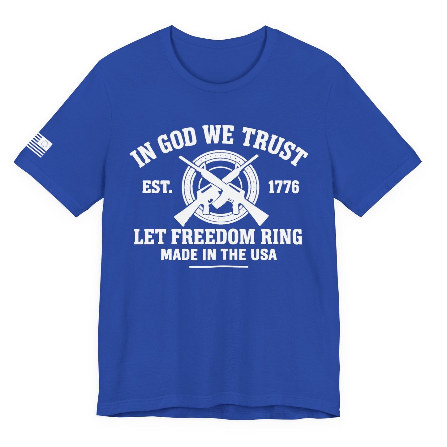 Royal Blue unisex t-shirt with white “IN GOD WE TRUST” crossed-rifles graphic and “LET FREEDOM RING” text, left-sleeve flag graphic, white background.