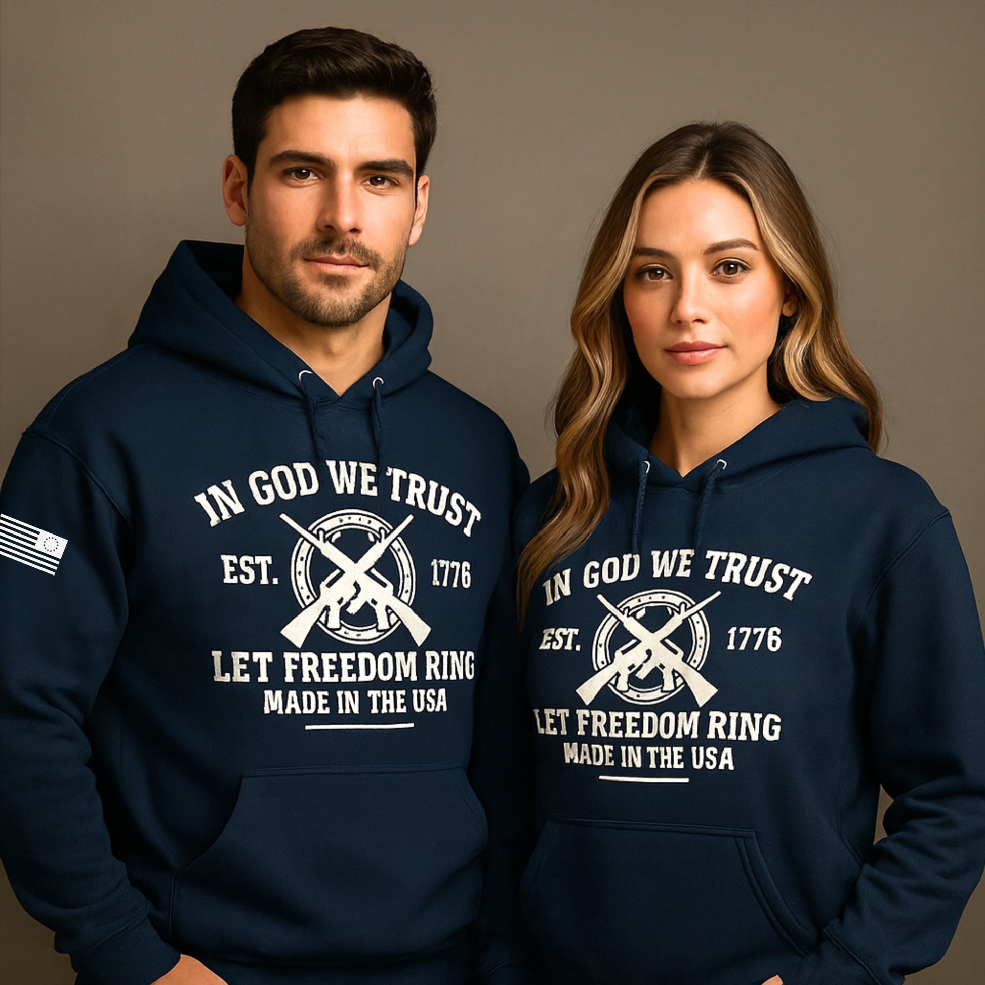 Unisex navy hoodie with “In God We Trust 1776 Let Freedom Ring” graphic and crossed rifles, front view, studio mockup