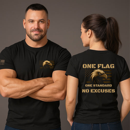 Man and woman wearing black ‘One Flag One Standard No Excuses’ t-shirts with bronze eagle and flag graphic, small chest print on front and large back print, on a gray studio background